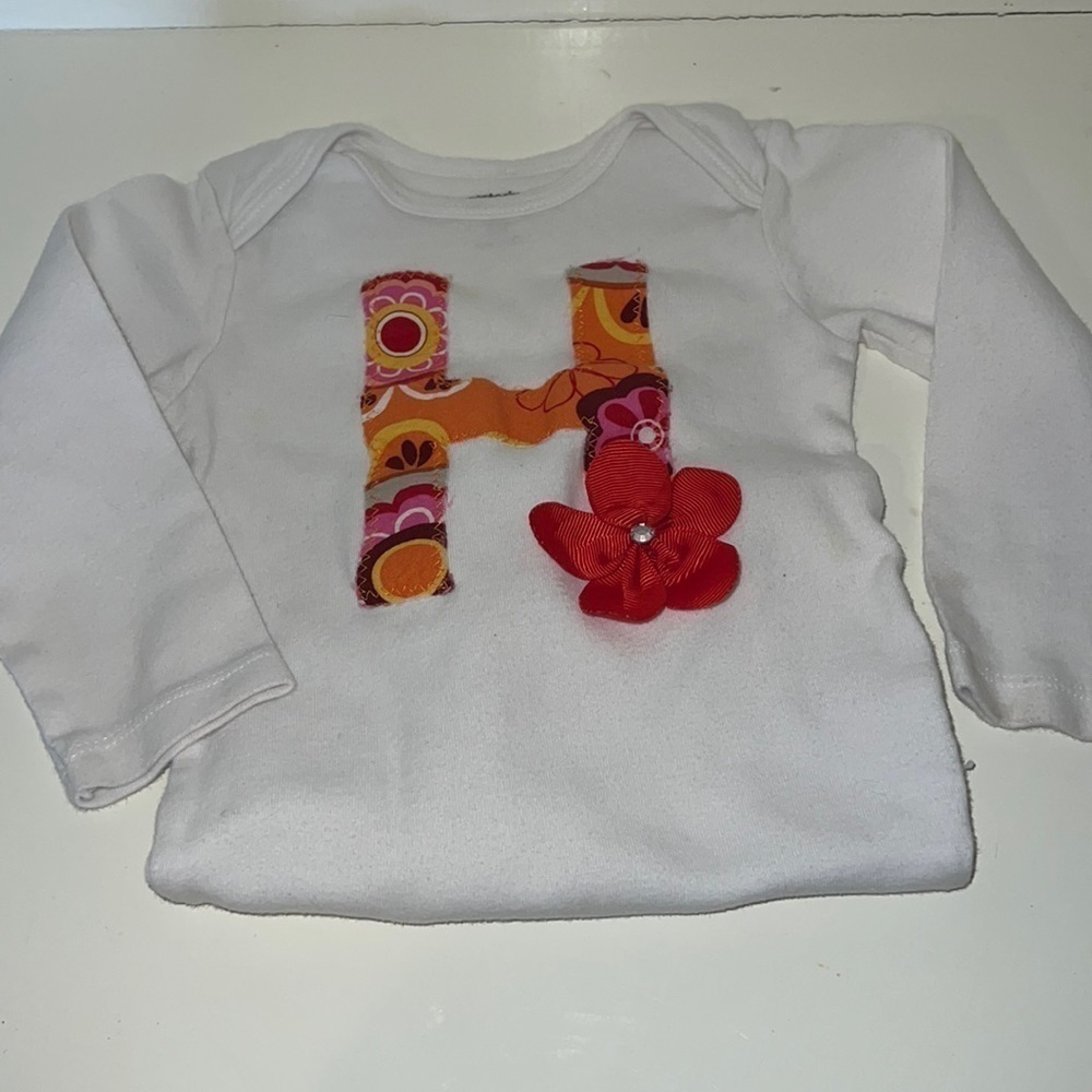Carter’s “H” Onsie